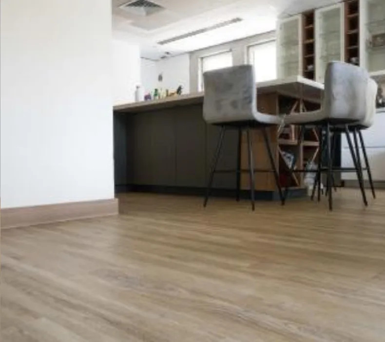 photo of a living space with a wood laminate floor